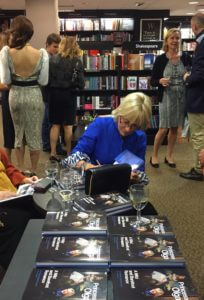 Princess Olga dutifully signed books for much of the evening